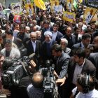 Angry Protestors Force Rouhani to Flee Rally in Tehran