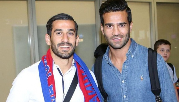 Iranian soccer stars Masoud Shojaei (right) and Ehsan Hajsafi (left).
