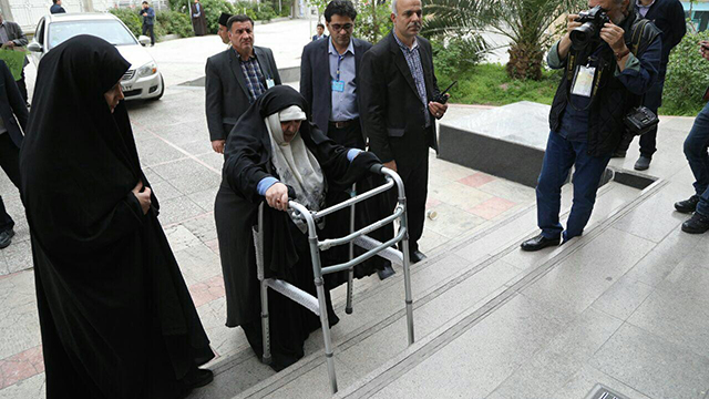 Prominent political activist, Azam Taleghani, 72, makes her way to the Ministry of the Interior to register, for the third time, for Iran's presidential election, this time for May 2017.