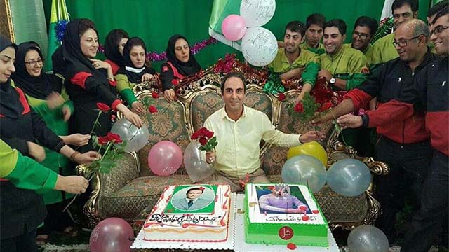 HL Glue company CEO Khalil Nazari surrounded by factory workers at his birthday party