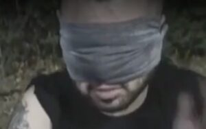 A screenshot of a video aired by Iranian state TV in which Toomaj, half his face covered by a blindfold, made a forced apology. Sources tell CHRI that his face was severely injured and that's why the blindfold is so large, to cover evidence of trauma to his face