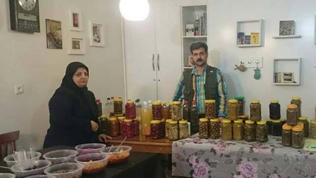 Reza Shahabi and his wife in their home grocery store.